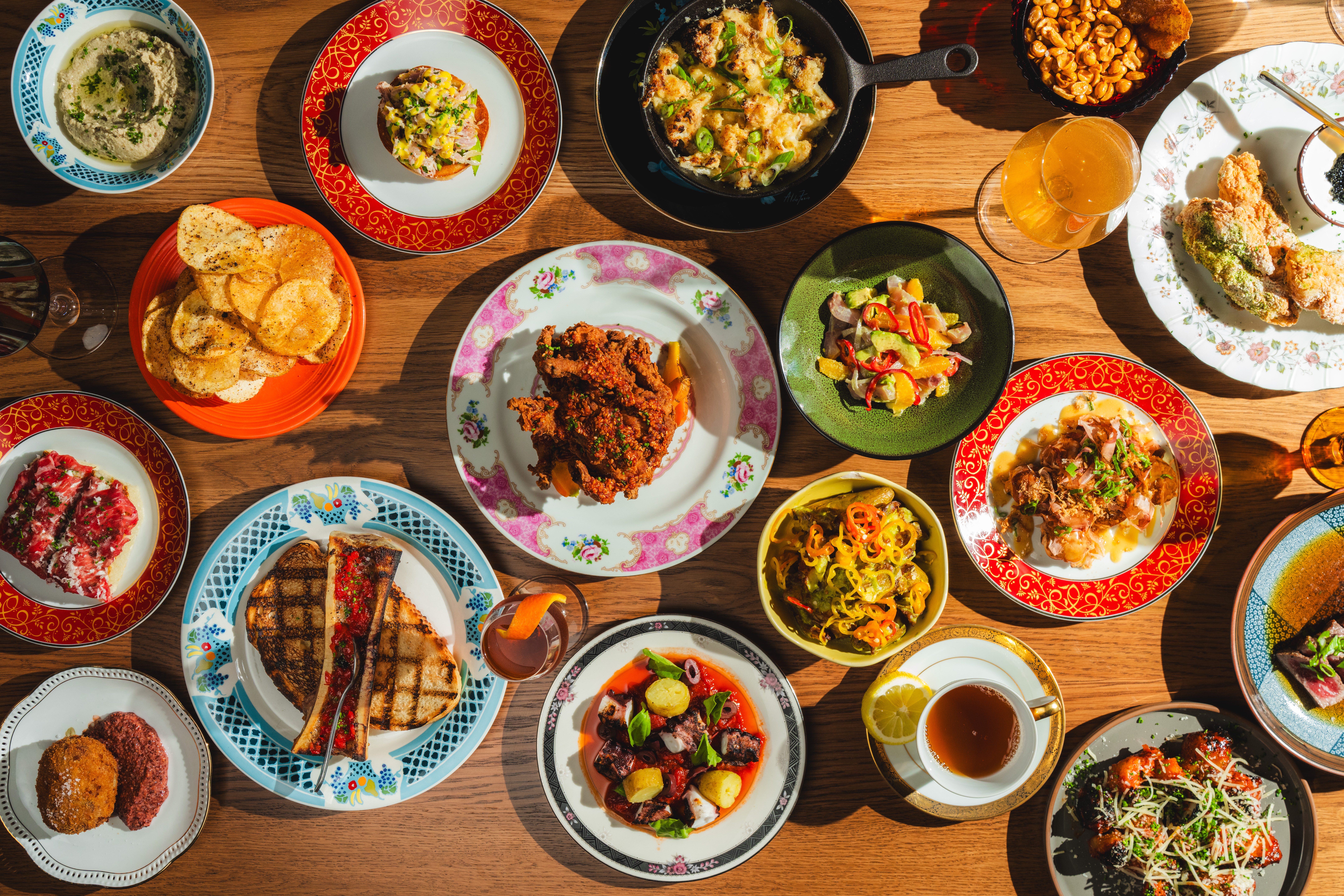 A shared spread of dishes across the table